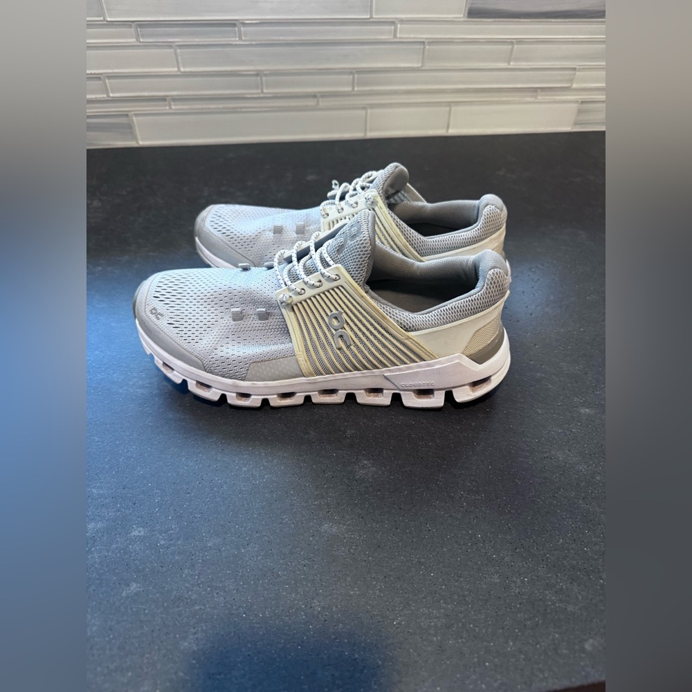 On Running Gray and White Athletic Shoes